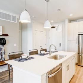 Spacious kitchens with thoughtful details a kitchen with white cabinets