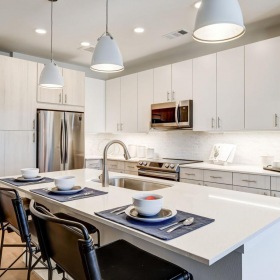 Spacious kitchens with thoughtful details a kitchen with white cabinets